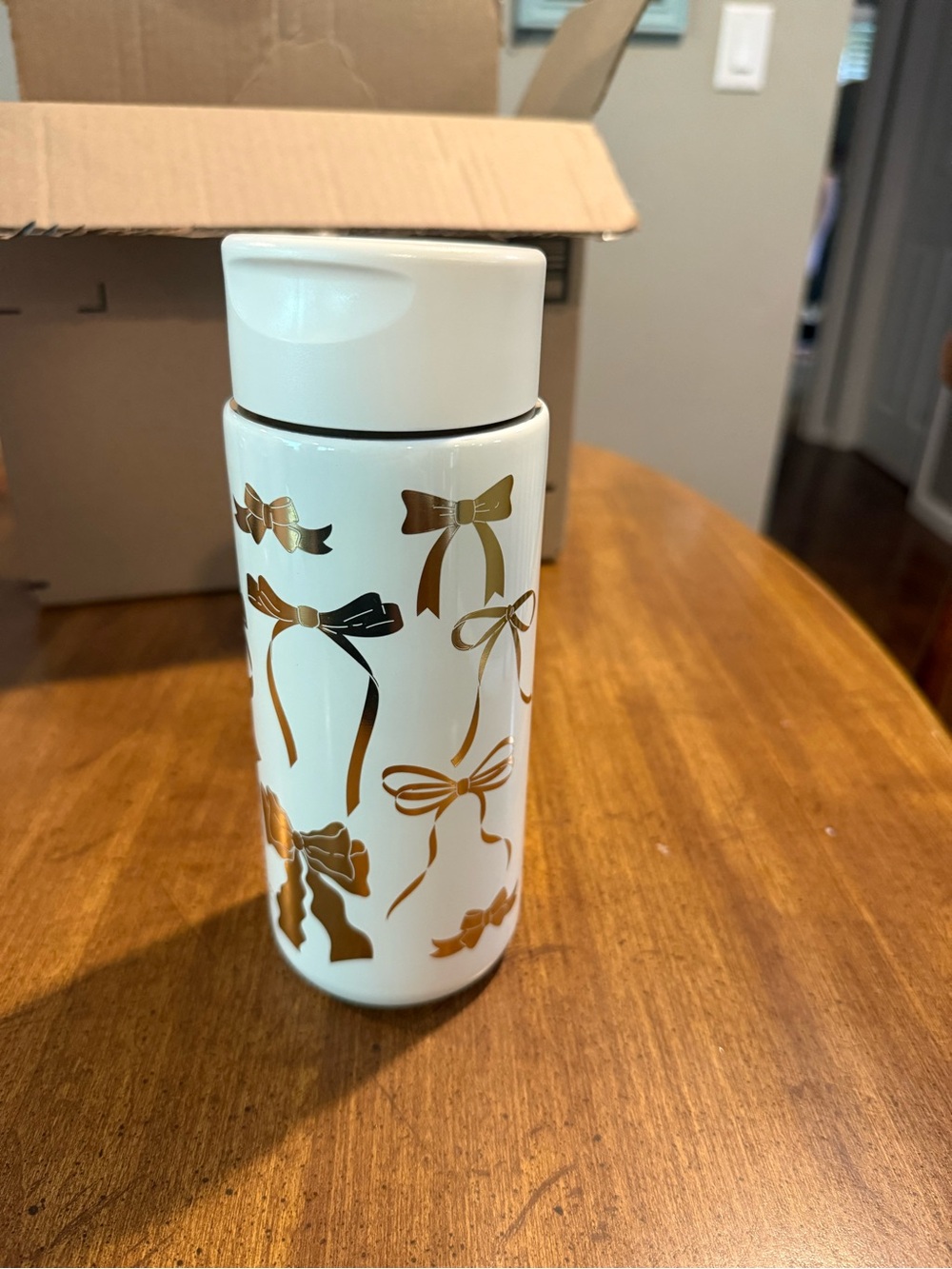 White Stainless Steel Travel Bottle with Gold Bow Design